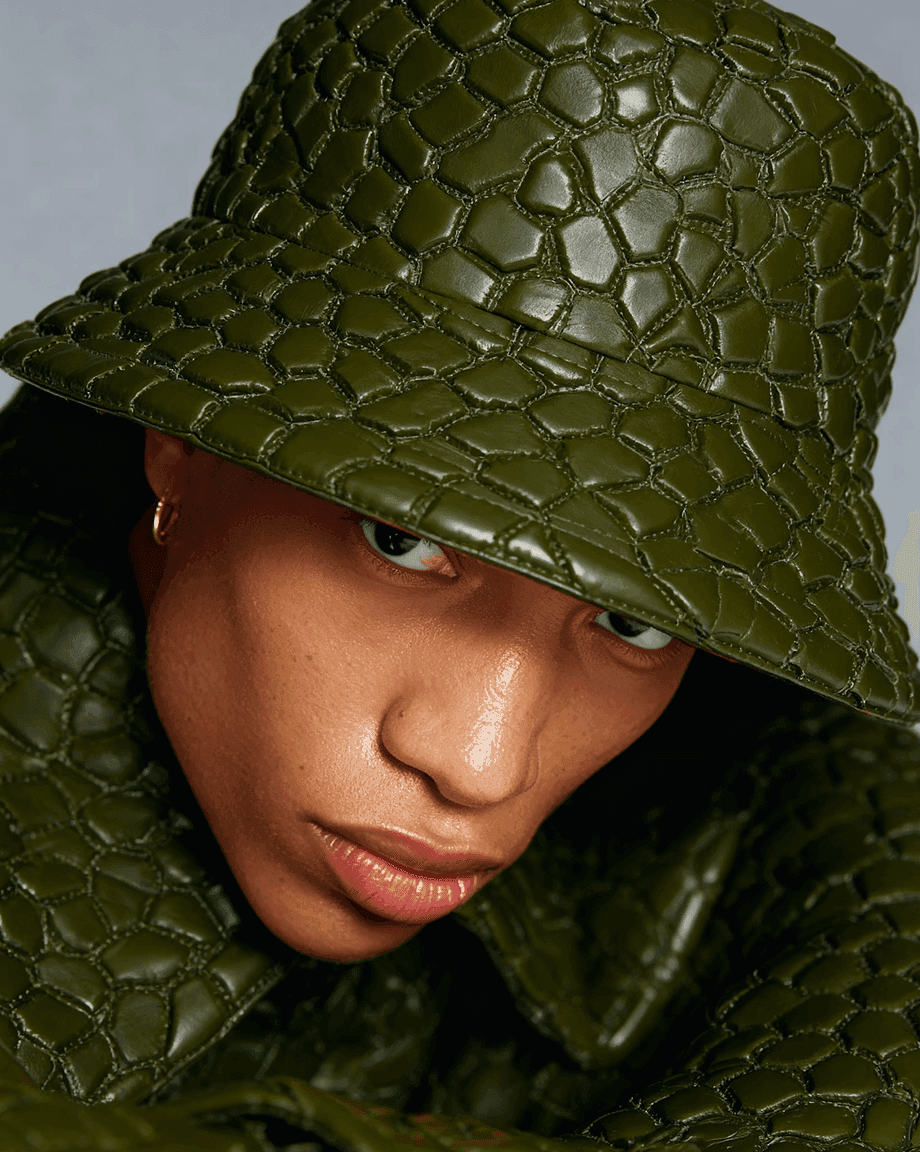Model in a green quilted leather bucket hat